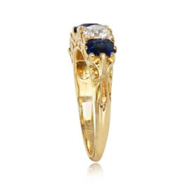 gold ring featuring sapphires and diamonds